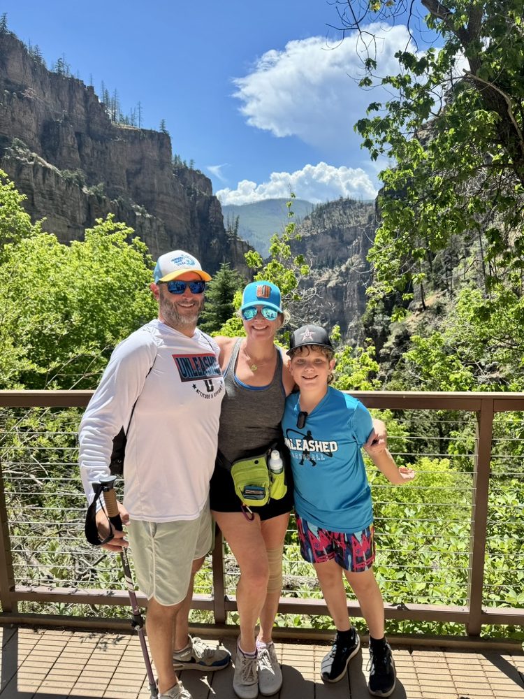 Laura and family hiking a canyon trail